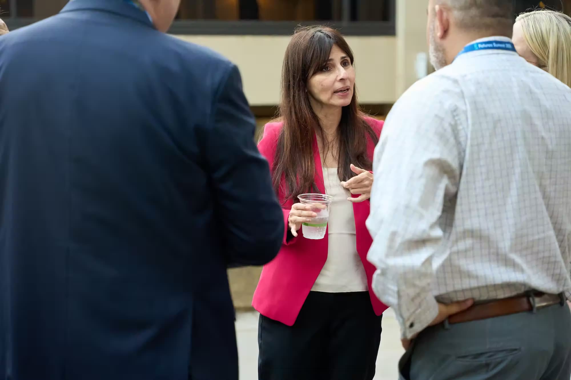 Chancellor Christian discussing with people